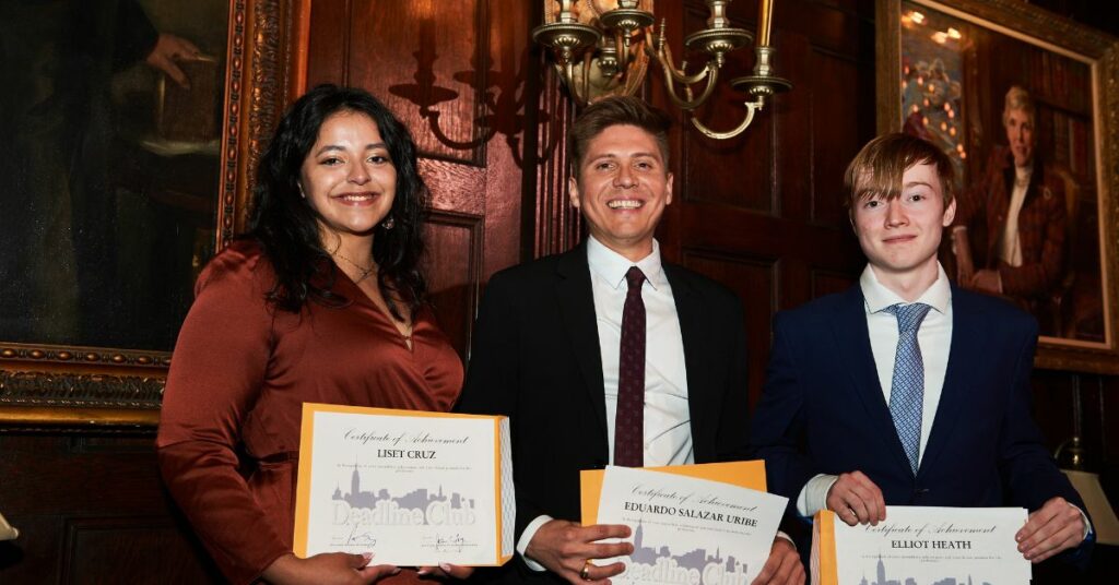 Students receiving scholarship certificates.
