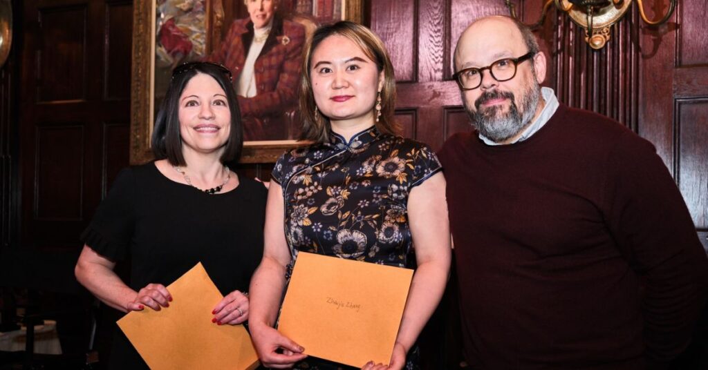 Scholarship winners Misha Valencia and Jinger Zhang with Terry Parris Jr.